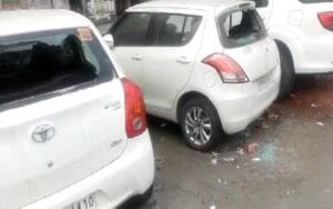 Broken glasses of vehicles parked on the side of the road,...