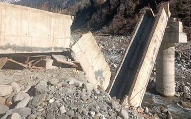 Under-construction bridge collapsed, laborers removing shuttering....